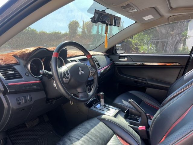 2014 中華三菱 Fortis 勁動版 灰色 1.8 認證車 里程保證 雙前座跑車座椅 天窗 換檔撥片 定速 大螢幕  第9張相片